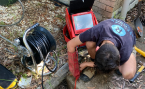 Rectify Plumbing plumber using jet blasting equipment clearing blocked drain