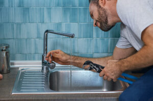 New tap installation against blue tile bathroom Rectify Plumbing