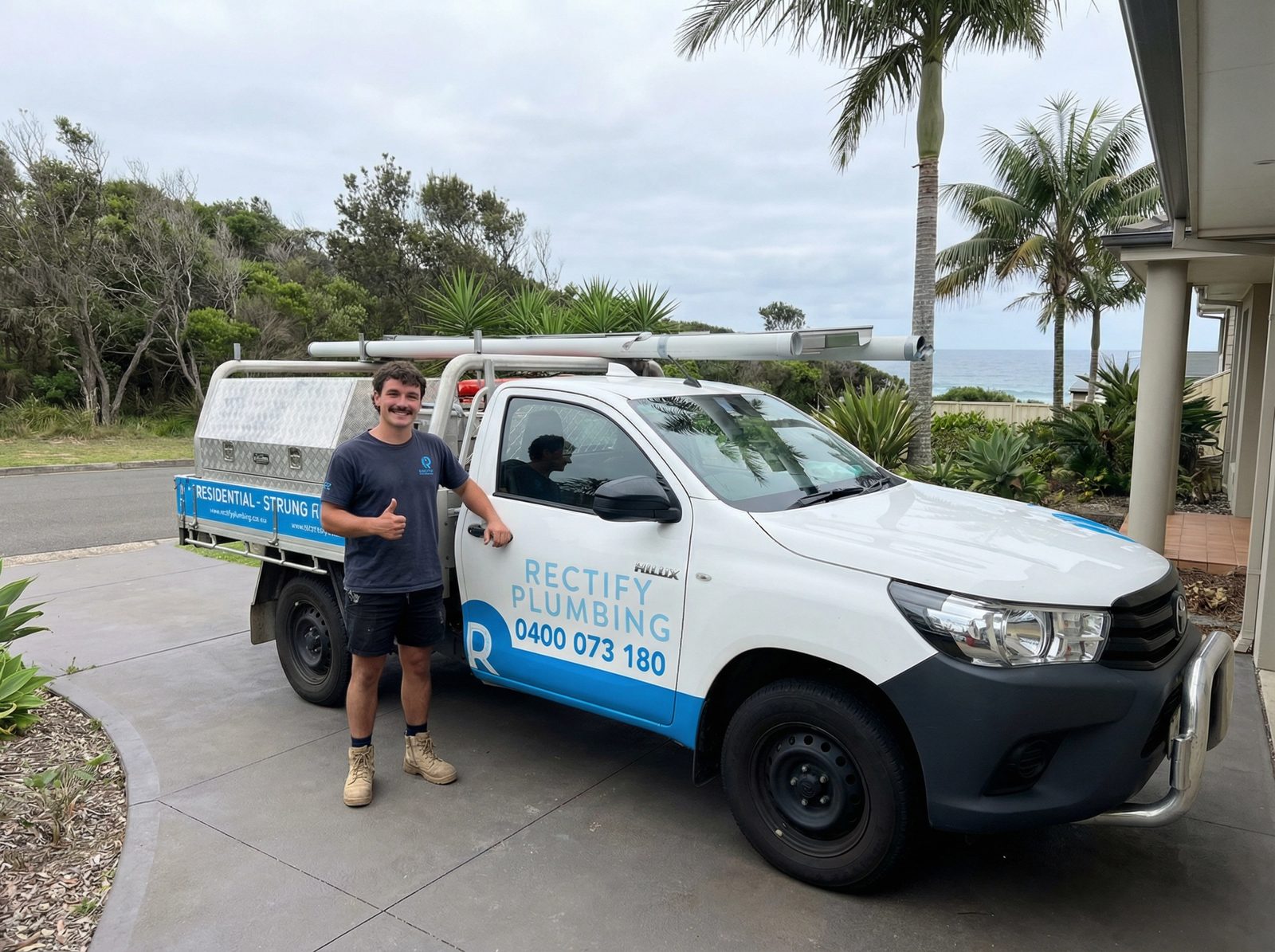 Licensed Rectify Plumbing plumber with the branded work ute arriving for a blocked drain callout
