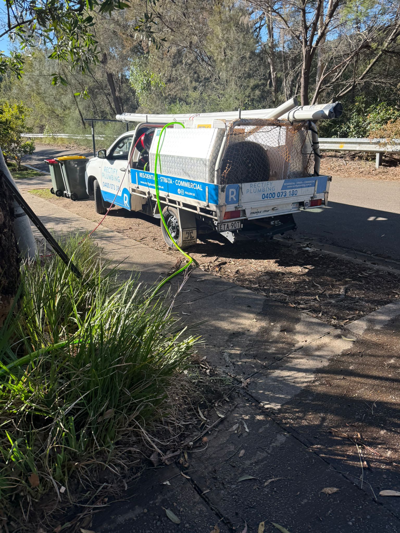 Branded Rectify Plumbing ute parked at a residential street in the Hornsby and Epping area