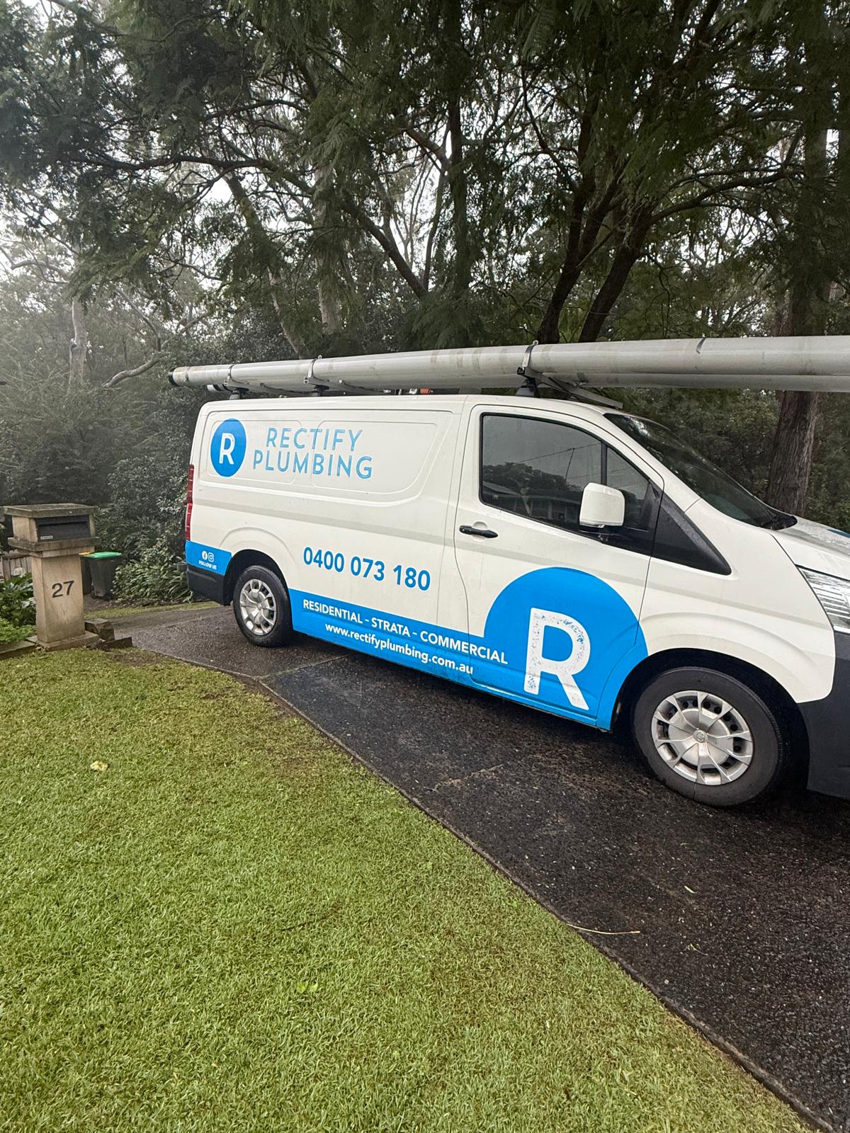 Branded Rectify Plumbing van parked at a Central Coast property for a blocked drain callout